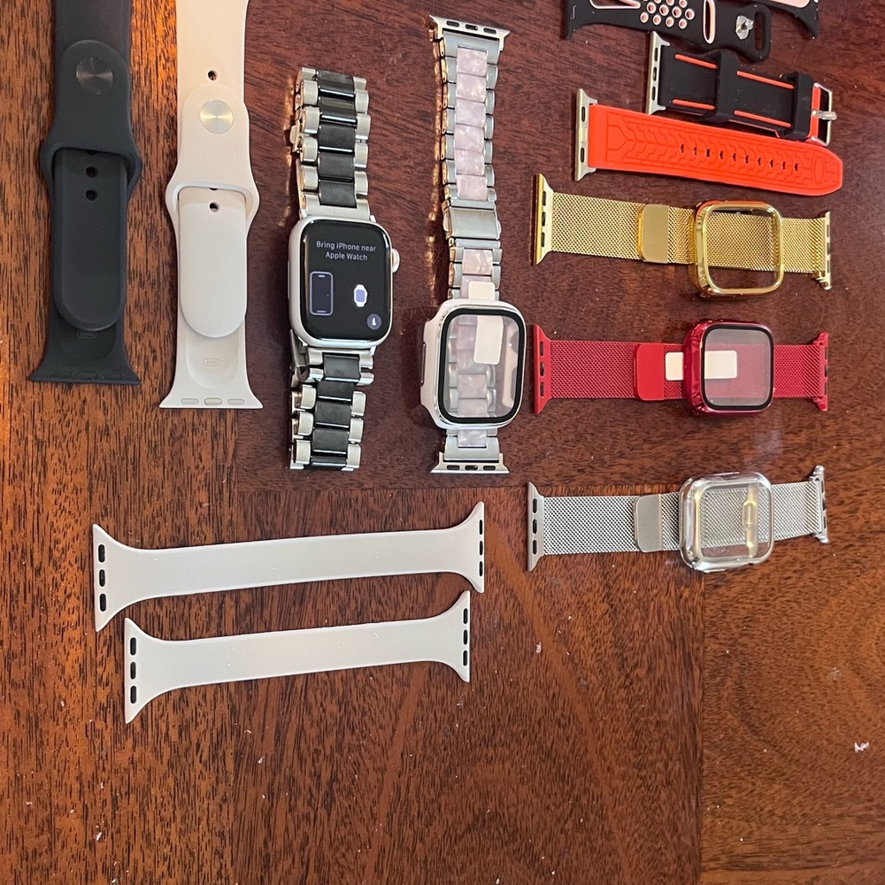 Apple Watch Series 8 w/band collection and cases.